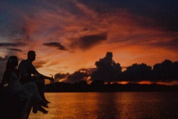 sunset cruises in el nido dark silhouette of a couple by beach