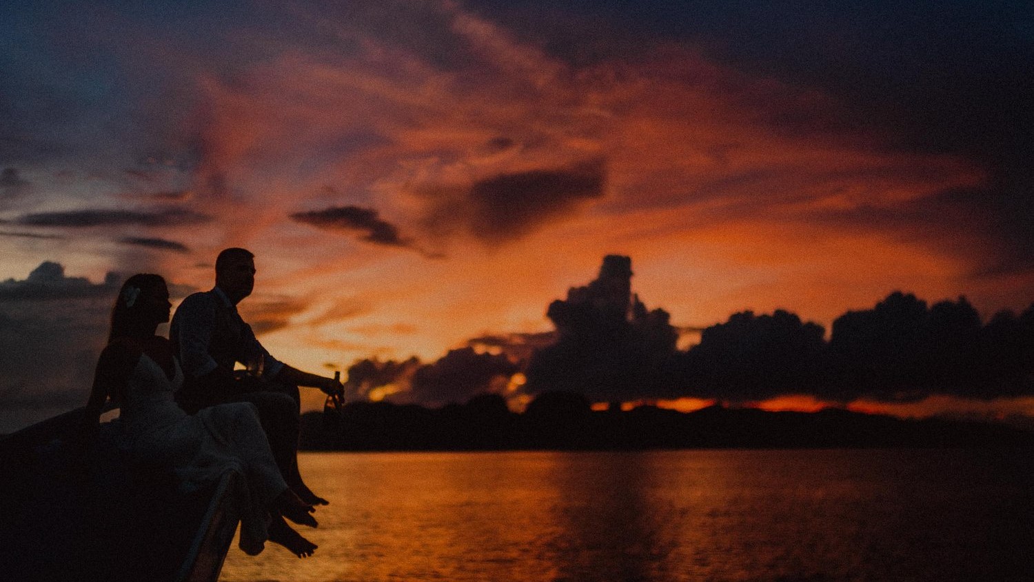 sunset cruises in el nido dark silhouette of a couple by beach